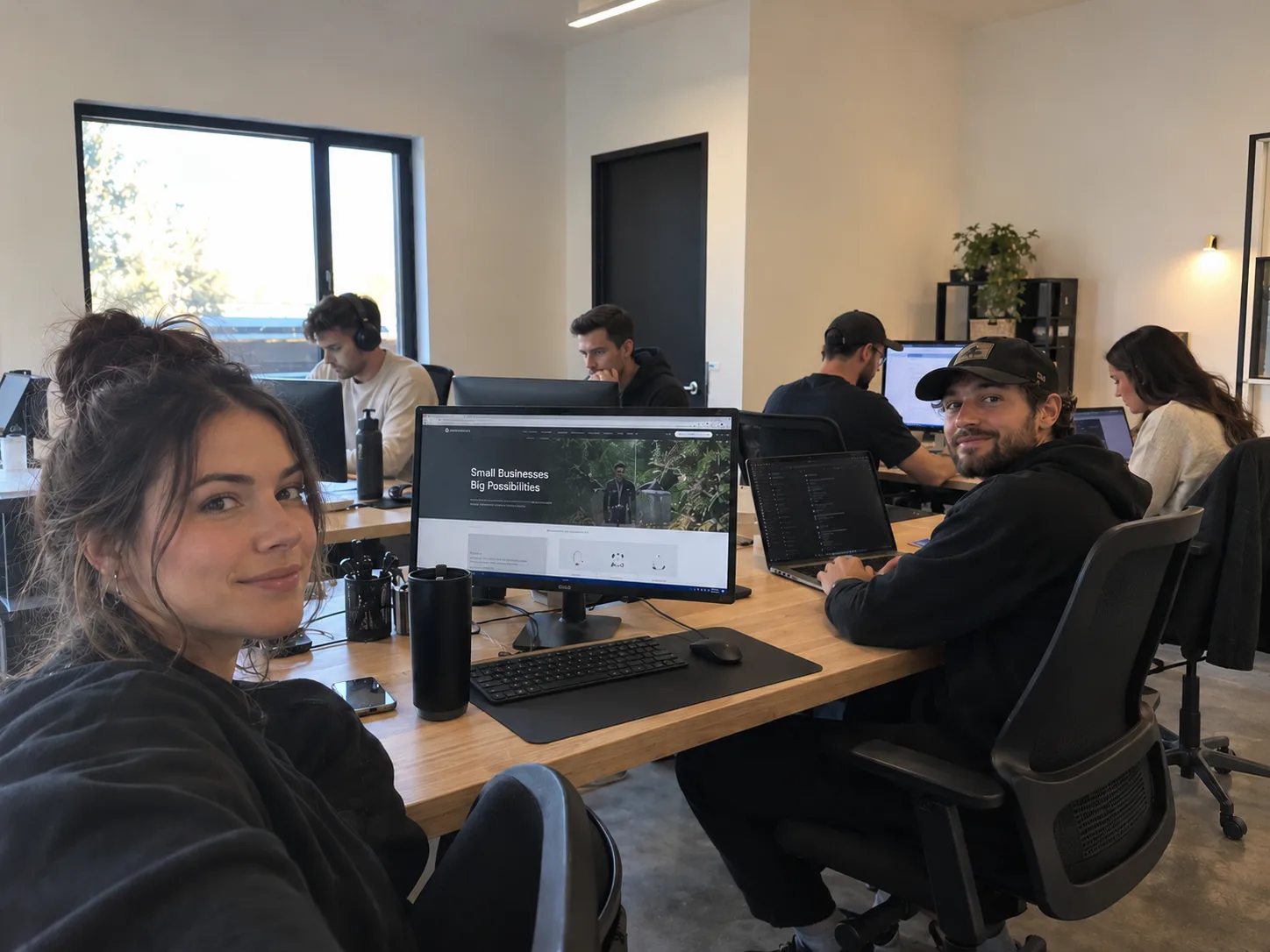 Small website design team working together in an office