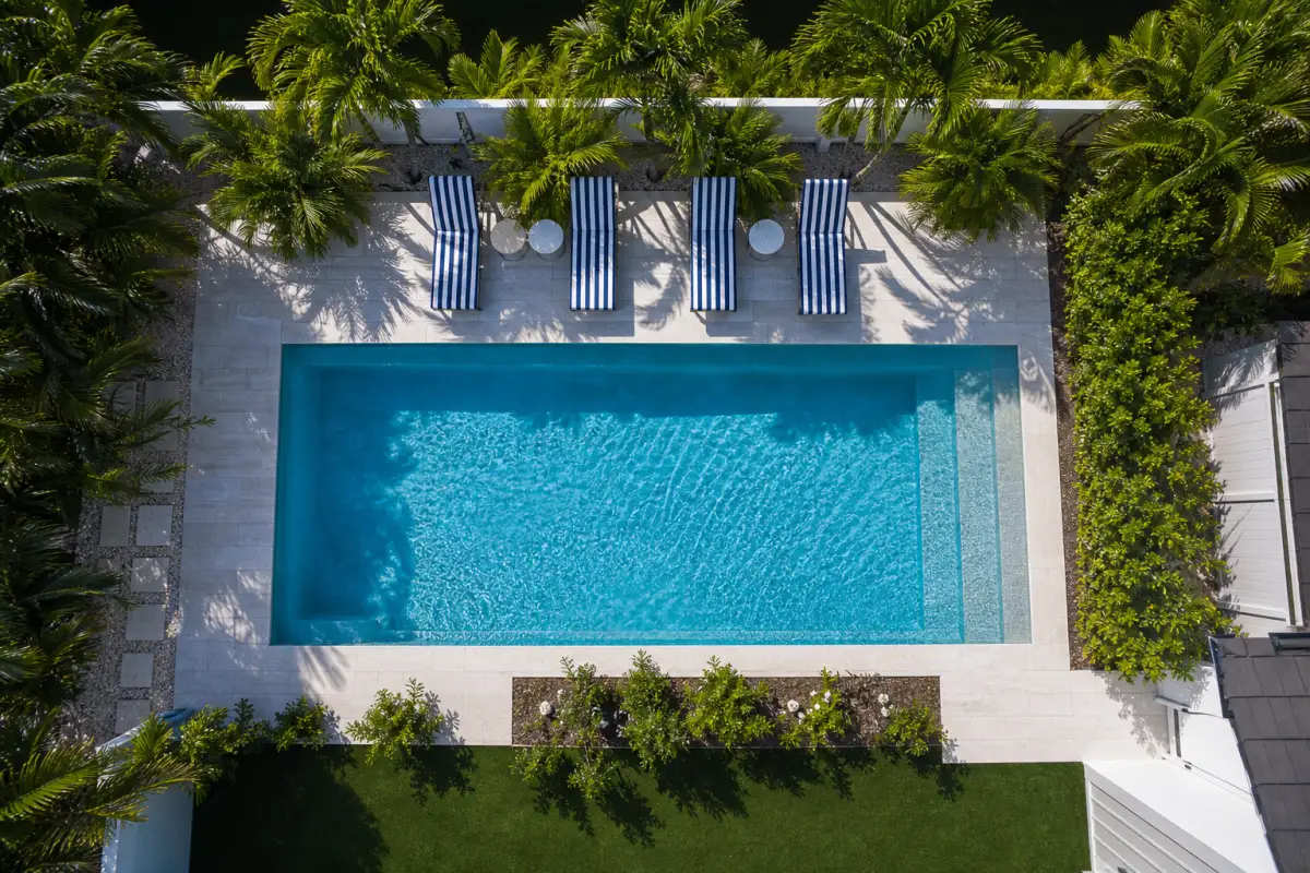 Aerial view of pool with striped loungers